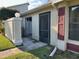 Home exterior showing front door, entryway, and partial siding at 98 Pine Island Cir, Kissimmee, FL 34743