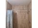 Shower with tiled walls and a decorative shower curtain and shower head at 98 Pine Island Cir, Kissimmee, FL 34743