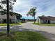 Street view of the community with well-maintained homes and landscaping at 98 Pine Island Cir, Kissimmee, FL 34743