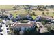 Condo building with parking and surrounding landscape at 13838 Fairway Island Dr # 1432, Orlando, FL 32837