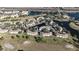 Aerial view of a community with buildings, landscaping, and lakes at 13838 Fairway Island Dr # 1432, Orlando, FL 32837