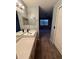 Modern bathroom with a double vanity and view of bedroom at 13838 Fairway Island Dr # 1432, Orlando, FL 32837