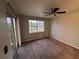 Spacious bedroom with carpet, large window and ceiling fan at 13838 Fairway Island Dr # 1432, Orlando, FL 32837