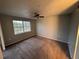Well lit bedroom with a ceiling fan and large window at 13838 Fairway Island Dr # 1432, Orlando, FL 32837