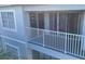Exterior view of condo balcony with white railings at 13838 Fairway Island Dr # 1432, Orlando, FL 32837