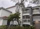 Building exterior with stairs and landscaping at 13838 Fairway Island Dr # 1432, Orlando, FL 32837