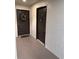 Hallway with two dark brown doors and a wreath at 13838 Fairway Island Dr # 1432, Orlando, FL 32837