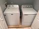 Laundry room with matching white Maytag washer and dryer at 13838 Fairway Island Dr # 1432, Orlando, FL 32837