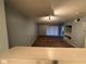 Living room with carpet and sliding glass doors leading to a patio at 13838 Fairway Island Dr # 1432, Orlando, FL 32837