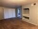Living room with built-in shelving and carpet at 13838 Fairway Island Dr # 1432, Orlando, FL 32837