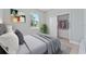 Cozy bedroom featuring a closet and a window for natural light at 1603 Tench Ct, Kissimmee, FL 34759