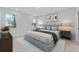 Serene main bedroom with ample natural light and neutral decor at 1603 Tench Ct, Kissimmee, FL 34759