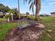 Outdoor benches amidst lush landscaping, offering a relaxing community space at 392 Winter Ridge Blvd # 105, Winter Haven, FL 33881