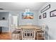 Cozy dining area with a round table set, complemented by elegant pendant lighting at 392 Winter Ridge Blvd # 105, Winter Haven, FL 33881