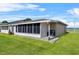 Well-kept enclosed lanai, perfect for enjoying the outdoors in comfort at 392 Winter Ridge Blvd # 105, Winter Haven, FL 33881