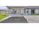 Charming condo featuring an outdoor patio and carport with designated parking space at 392 Winter Ridge Blvd # 105, Winter Haven, FL 33881