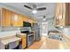 Functional kitchen featuring stainless steel appliances, wood cabinets, and a convenient workstation at 392 Winter Ridge Blvd # 105, Winter Haven, FL 33881