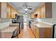 Well-equipped kitchen with stainless steel appliances, wood cabinets, and a practical layout at 392 Winter Ridge Blvd # 105, Winter Haven, FL 33881