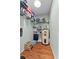 Organized pantry with shelving, water heater, and storage for household essentials, maximizing space at 392 Winter Ridge Blvd # 105, Winter Haven, FL 33881