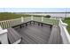 Spacious patio area with benches offers a serene waterfront view at 392 Winter Ridge Blvd # 105, Winter Haven, FL 33881