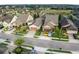 Aerial view of a residential community with houses and landscaping at 516 Pamplona Pl, Davenport, FL 33837