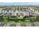 An aerial view of a house nestled within a quiet residential community at 516 Pamplona Pl, Davenport, FL 33837
