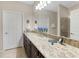 Double vanity bathroom with granite countertops at 516 Pamplona Pl, Davenport, FL 33837
