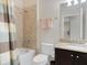 Clean bathroom with shower/tub, granite vanity, and updated tile at 516 Pamplona Pl, Davenport, FL 33837