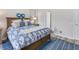 Spacious bedroom with wood flooring and a plush bed at 516 Pamplona Pl, Davenport, FL 33837