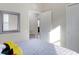 Bright bedroom with a door to another room and a large mirror at 516 Pamplona Pl, Davenport, FL 33837