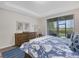Bright bedroom with sliding doors leading to backyard at 516 Pamplona Pl, Davenport, FL 33837