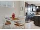 Bright dining area adjacent to kitchen with stainless steel appliances at 516 Pamplona Pl, Davenport, FL 33837