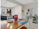 Dining area with table and chairs, open to kitchen and living room at 516 Pamplona Pl, Davenport, FL 33837
