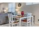 Casual dining area with white table and chairs, near kitchen at 516 Pamplona Pl, Davenport, FL 33837