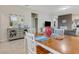 Open dining area with view of living room and kitchen at 516 Pamplona Pl, Davenport, FL 33837