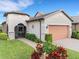 One-story home with a two-car garage and landscaped yard at 516 Pamplona Pl, Davenport, FL 33837