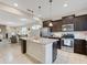 Modern kitchen with granite island and stainless steel appliances at 516 Pamplona Pl, Davenport, FL 33837