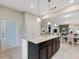 Modern kitchen with granite island and stainless steel appliances at 516 Pamplona Pl, Davenport, FL 33837