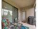 Cozy screened porch with seating area and grill at 516 Pamplona Pl, Davenport, FL 33837