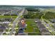 Aerial view showcasing the property's location within a residential neighborhood, close to green spaces and waterways at 1687 Park Side Ave, Kissimmee, FL 34744