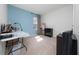 A spacious bedroom featuring a large window, carpeted floors, and a desk, offering a comfortable living space at 1687 Park Side Ave, Kissimmee, FL 34744