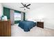 Comfortable bedroom featuring a cozy bed and stylish ceiling fan at 1687 Park Side Ave, Kissimmee, FL 34744