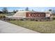 Welcoming entrance to Kindred community features a beautiful stone tiered fountain with lush landscaping and sidewalk at 1687 Park Side Ave, Kissimmee, FL 34744