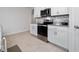 Well-lit kitchen showcasing white cabinets, granite countertops, and stainless steel range at 1687 Park Side Ave, Kissimmee, FL 34744