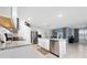 Open kitchen featuring white cabinets, granite countertops, and stainless steel appliances at 1687 Park Side Ave, Kissimmee, FL 34744