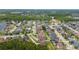 Aerial view of the home and surrounding community with mature trees and landscaping at 18035 Cadence St, Orlando, FL 32820