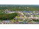 Aerial view of the property nestled within a scenic community near the lake at 18035 Cadence St, Orlando, FL 32820