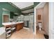 Bathroom with dual sinks, a glass-enclosed shower, and toilet, offering convenience and functionality at 18035 Cadence St, Orlando, FL 32820