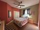 Cozy bedroom with double bed, carpet flooring, and ceiling fan at 18035 Cadence St, Orlando, FL 32820