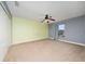 Bedroom with neutral carpet, closet and ceiling fan at 18035 Cadence St, Orlando, FL 32820